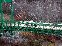 Truck hauling boards on Bridge - Click for larger image